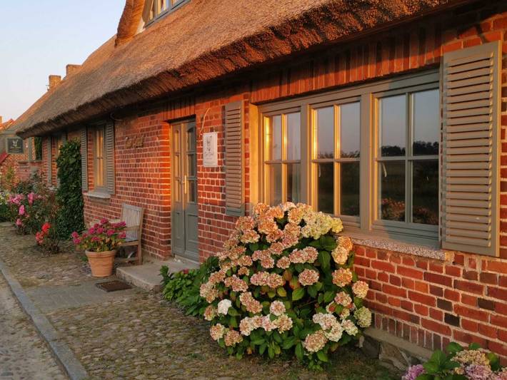 Ferienwohnung für 6 Personen, mit Terrasse und Garten sowie Seeblick und Ausblick in Lancken-Granitz