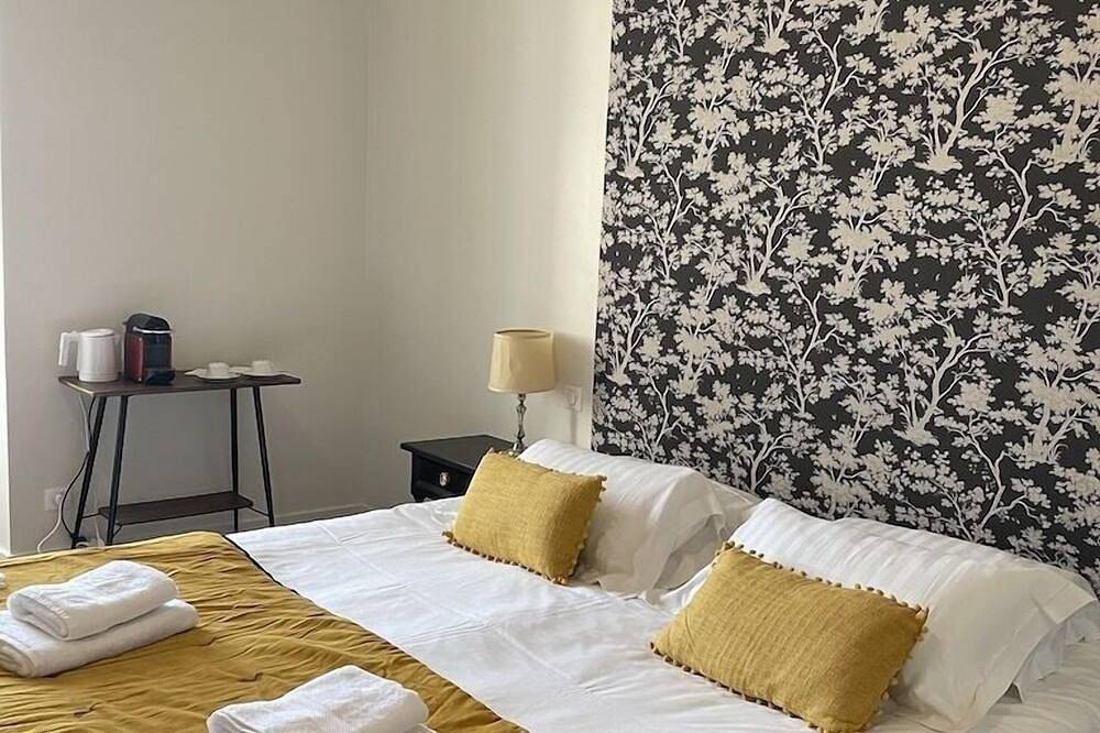 Lavishly decorated double room at Château Le Fresne in Bouchemaine, Angers region