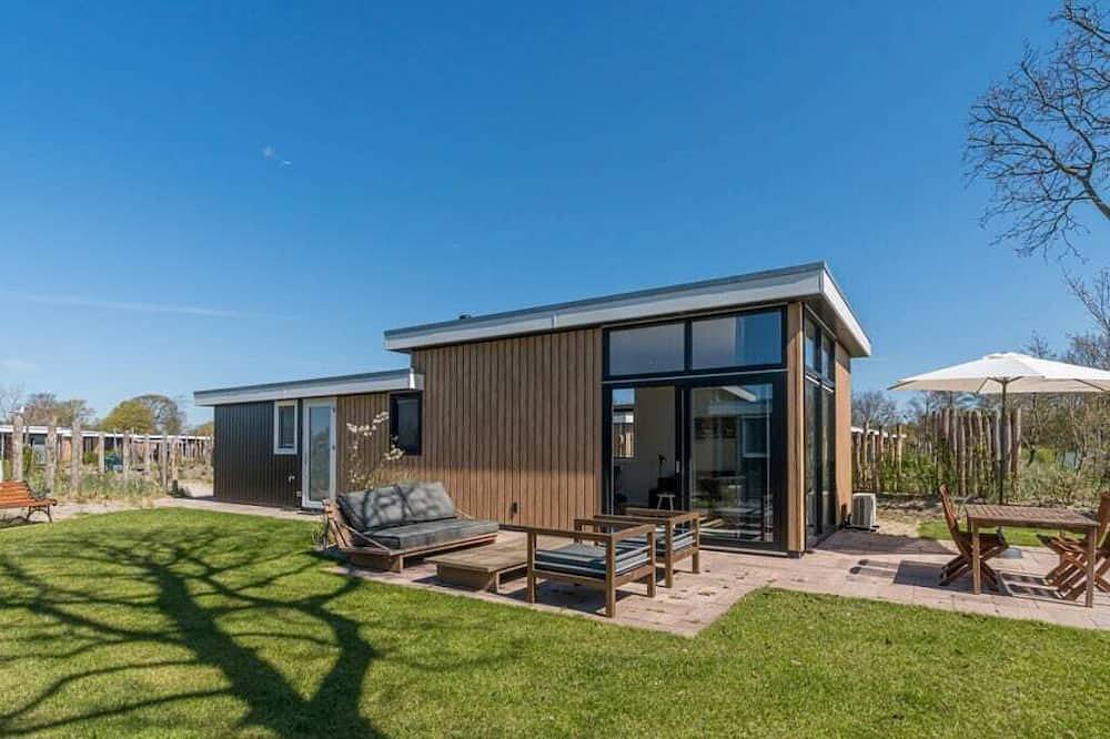Dieses Chalet für 4 Personen heißt Sie am Rande des Parks willkommen. Das Chalet verfügt über ein mo in Burgh-Haamstede, Zeeuwse Kust