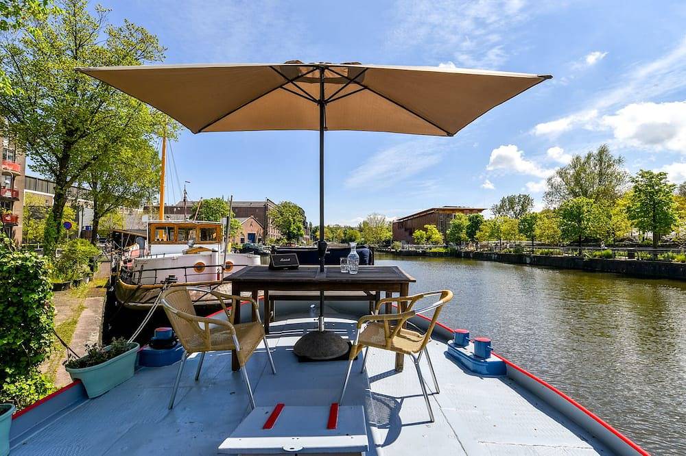 Beautiful houseboat in Amsterdam City Centre in Dutch Coast