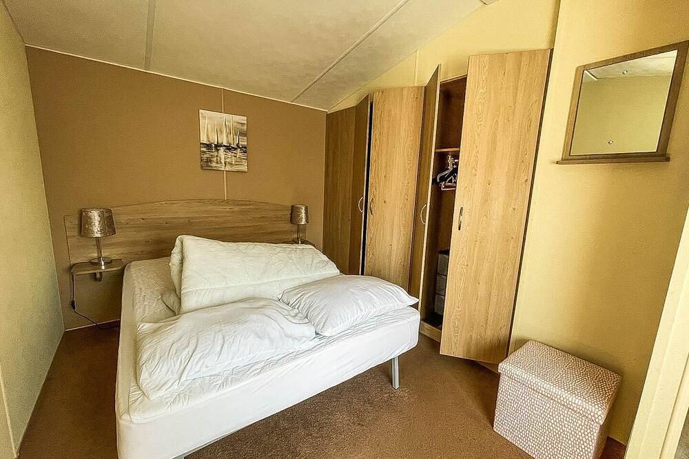 Caravan with large decking at Coopers Beach Holiday Park ref 49036Ts in Mersea Island, Colchester