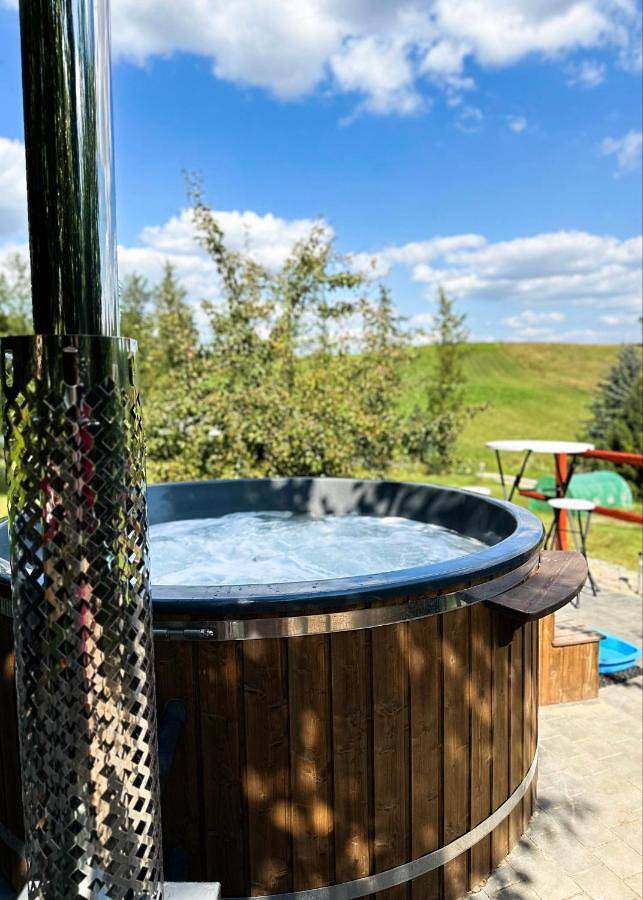 Domek letniskowy dla 10 osób, z Jacuzzi i Taras oraz Widok na jezioro w 