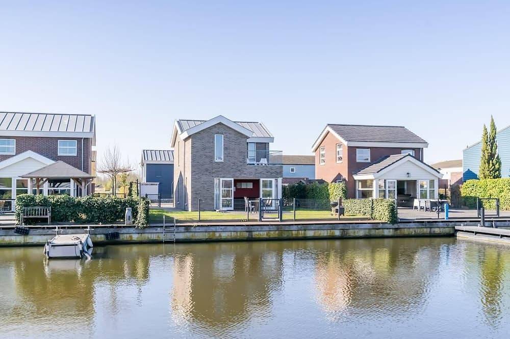 Helles und farbenfrohes freistehendes Inselhaus mit umzäuntem Garten. in Oude-Tonge, Goeree-Overflakkee