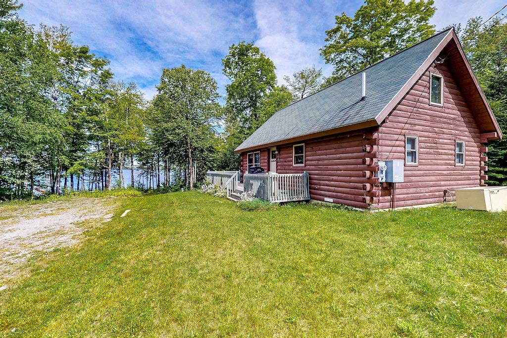 Lakefront cabin on First Roach Pond with dock, lake view & firepit- dog-friendly in Piscataquis County
