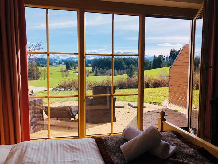 Ferienwohnung für 2 Personen, mit Terrasse und Garten sowie Kinderpool und Seeblick in Rückholz