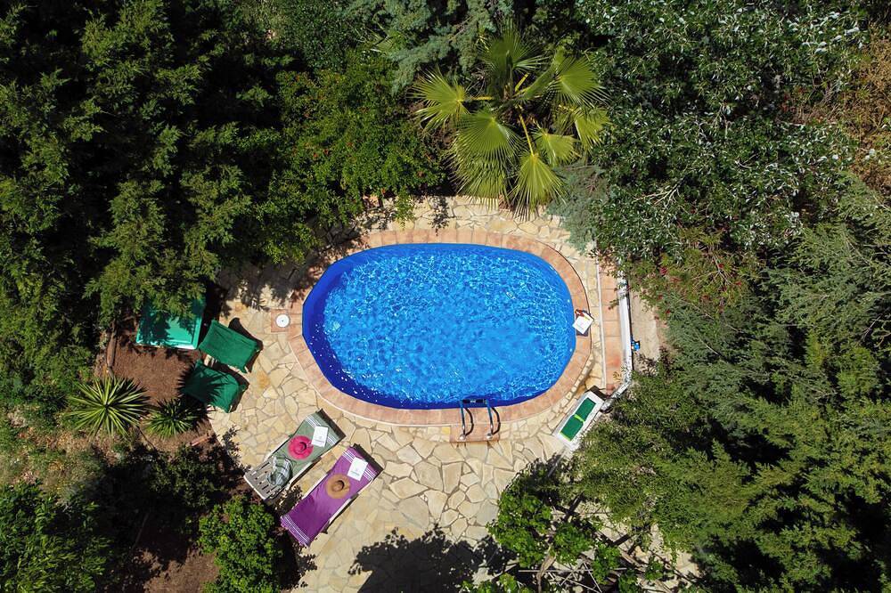 Sheltered house in the mountains with sea views and private pool. in Sedella, Málaga Province