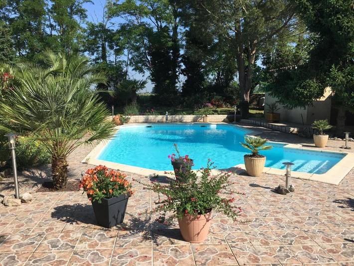 Appartement de vacances pour 4 personnes, avec Terrasse et Jardin ainsi que Piscine et Vue
