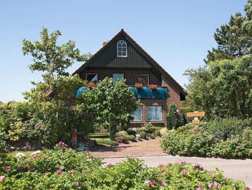 Ferienwohnung für 5 Personen, mit Balkon und Garten, kinderfreundlich in Harlesiel