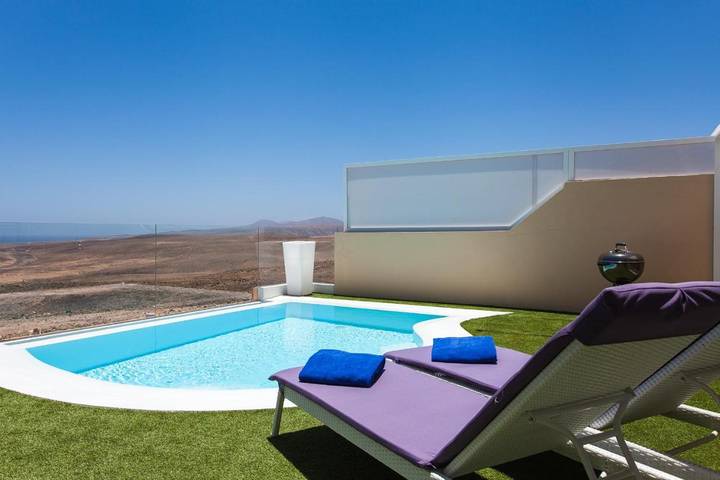 Chalet para 4 personas, con jardín además de piscina y vistas en Caleta de Fuste