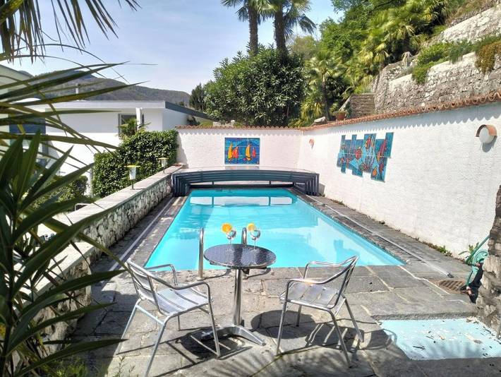 Ferienwohnung für 7 Personen, mit Balkon und Terrasse sowie Garten und Pool in Caslano