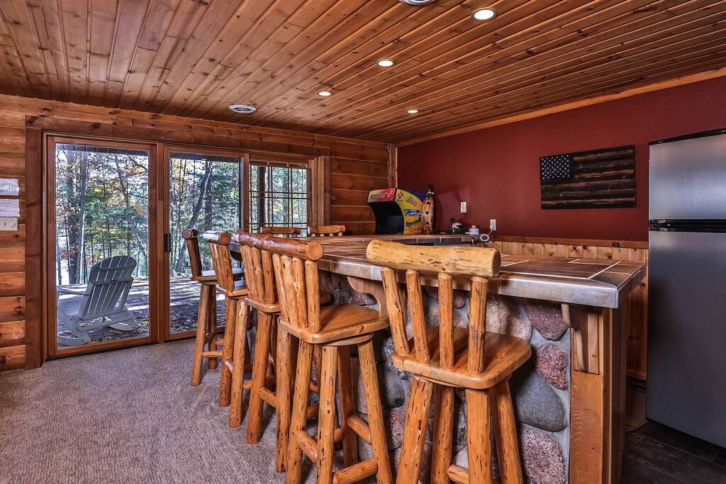 Dog-friendly, lakefront lodge in the woods with large dock, central Ac, & canoe in Vilas County