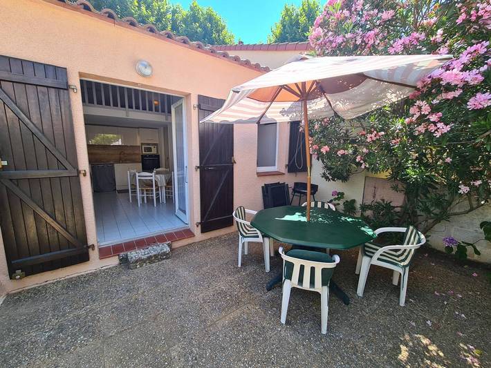 Appartement de vacances pour 4 personnes, avec Terrasse ainsi que Jardin et Piscine