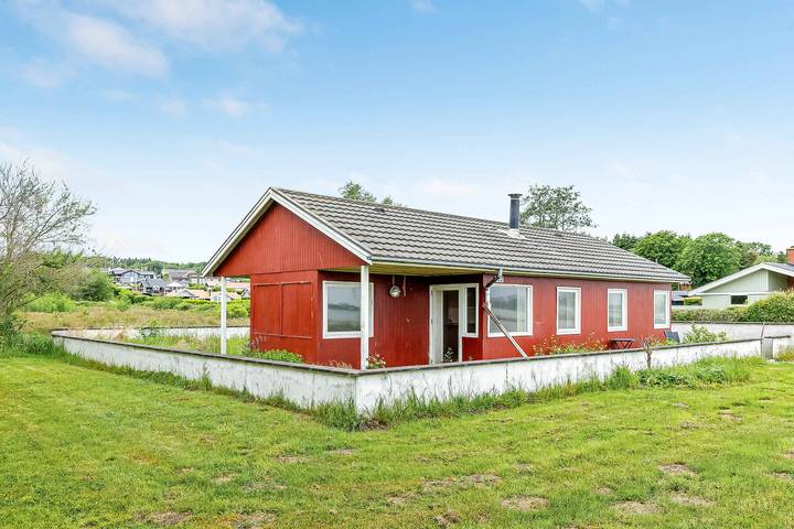 Huisje aan zee voor 7 personen, with uitzicht and tuin as well as uitzicht op het meer in Denemarken