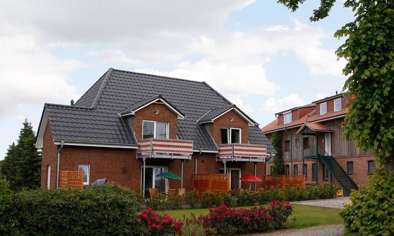 Ferienwohnung für 3 Personen, mit Balkon und Terrasse sowie Garten und Ausblick in Groß Wittensee