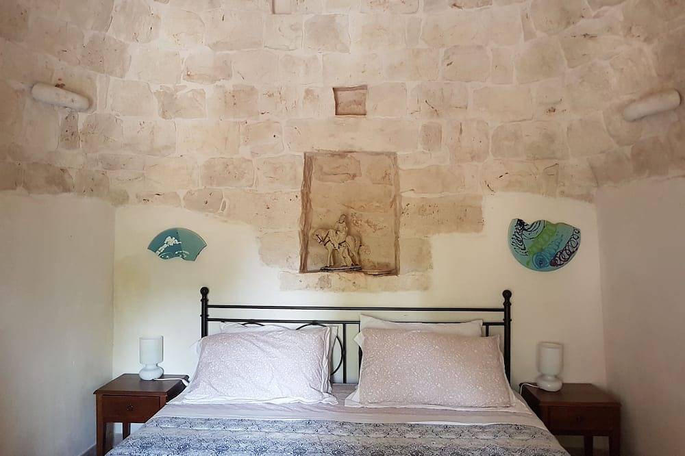 Trullo in an evergreen olive grove in Salento, Apulia. in Ceglie Messapica, Salento