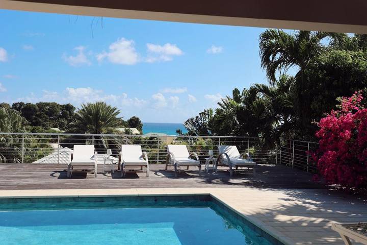 Location de vacances pour 10 personnes, avec piscine ainsi que vue et jardin dans Plage de l’Anse Vinaigri