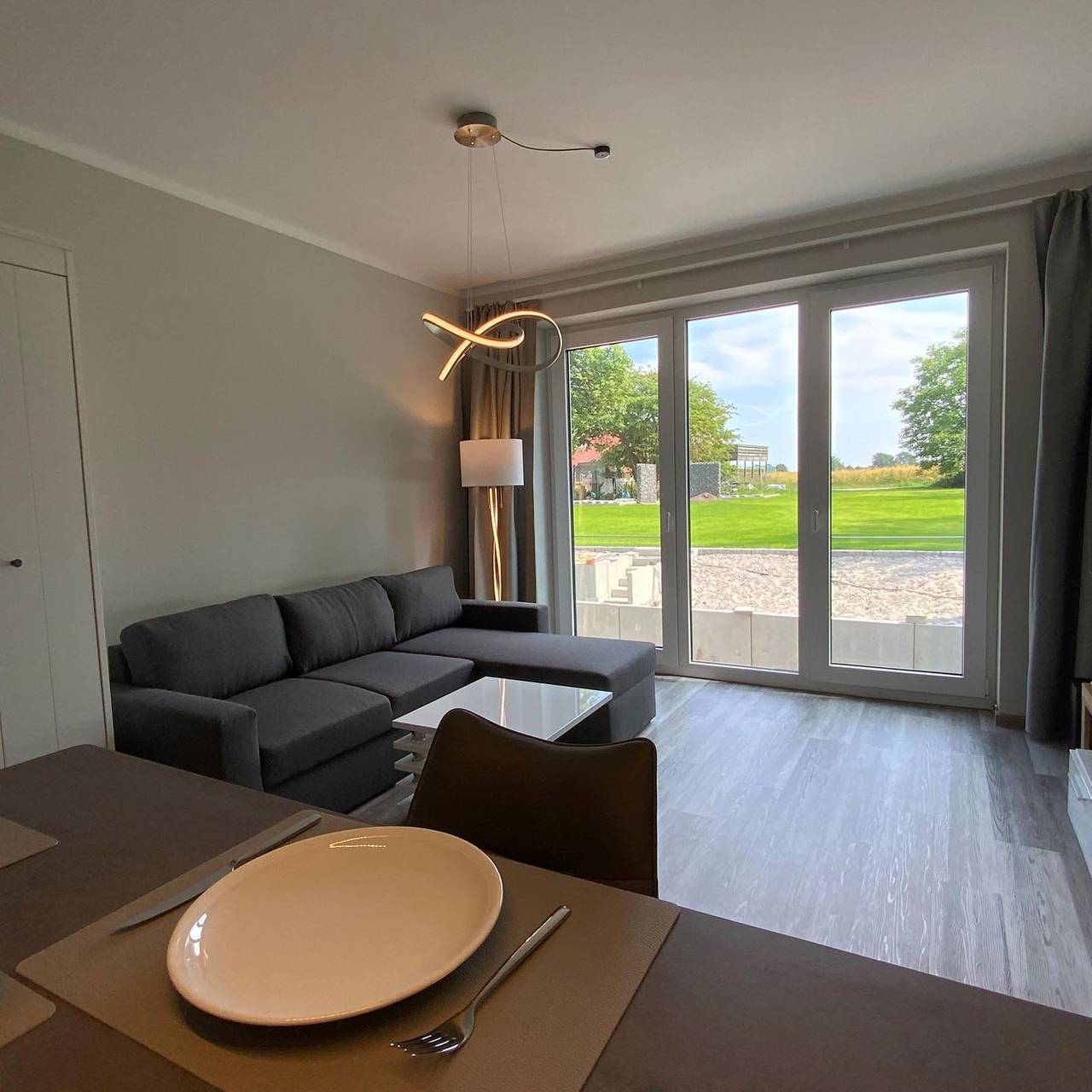 Ganze Wohnung, Modernes Apartment in Petersdorf mit Gartenblick und hochwertiger Ausstattung in Westfehmarn, Petersdorf auf Fehmarn