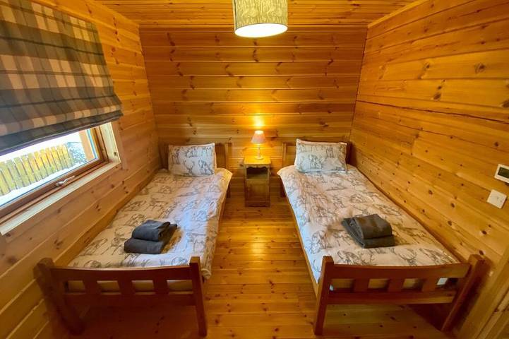 A traditional Scandinavian style lodge, with stylish wooden interior decorated with a Scottish theme in Lothian