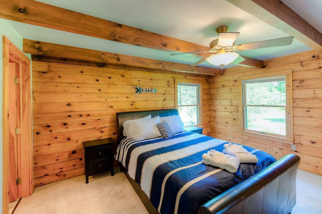 Three-story dog-friendly home with large deck, wood swing, firepit, lawn, & more in Lake Anna