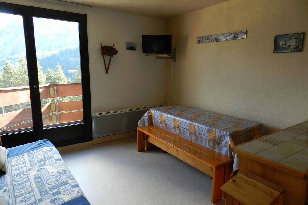 Appartement entier, Appartement cosy au pied des pistes avec balcon, ascenseur, casier à skis et parking gratuit in La Ferrière, Le Pleynet Les Sept Laux