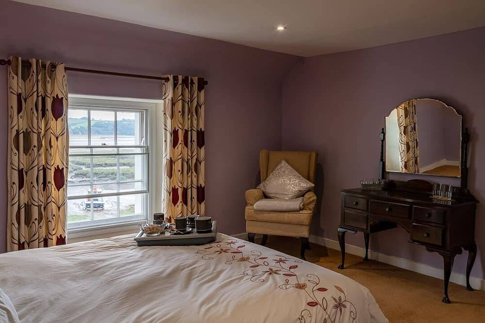Property looking at Dylan Thomas boat house and Laugharne Castle. in Laugharne, Carmarthenshire