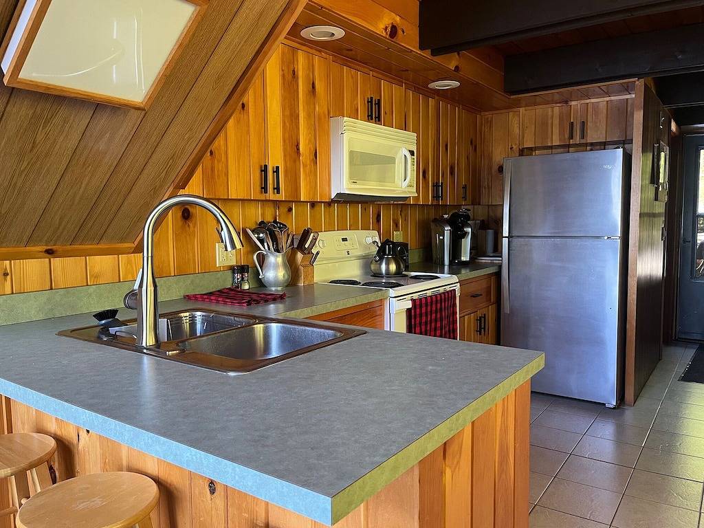 Secluded lakefront cottage with private beach Lakes Region, Denmark Maine in Oxford County