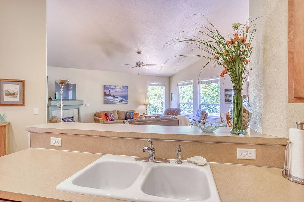 Warm, Modern Single-Level Home Overlooking Netarts Bay Has Ocean Peek and More! in Netarts, Tillamook County