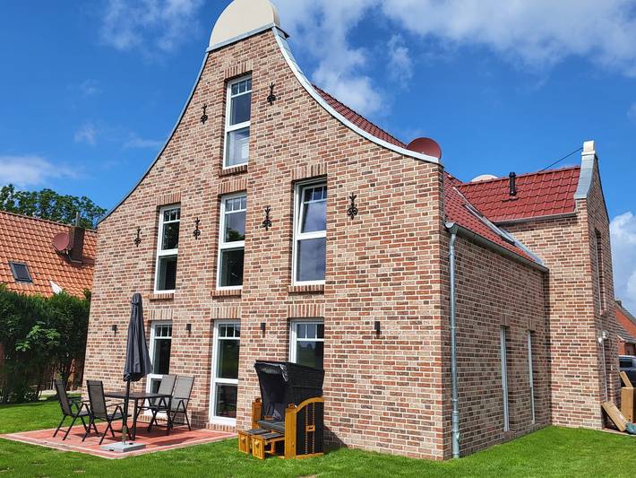 Ferienwohnung für 4 Personen, mit Terrasse und Garten sowie Ausblick in Krummhörn