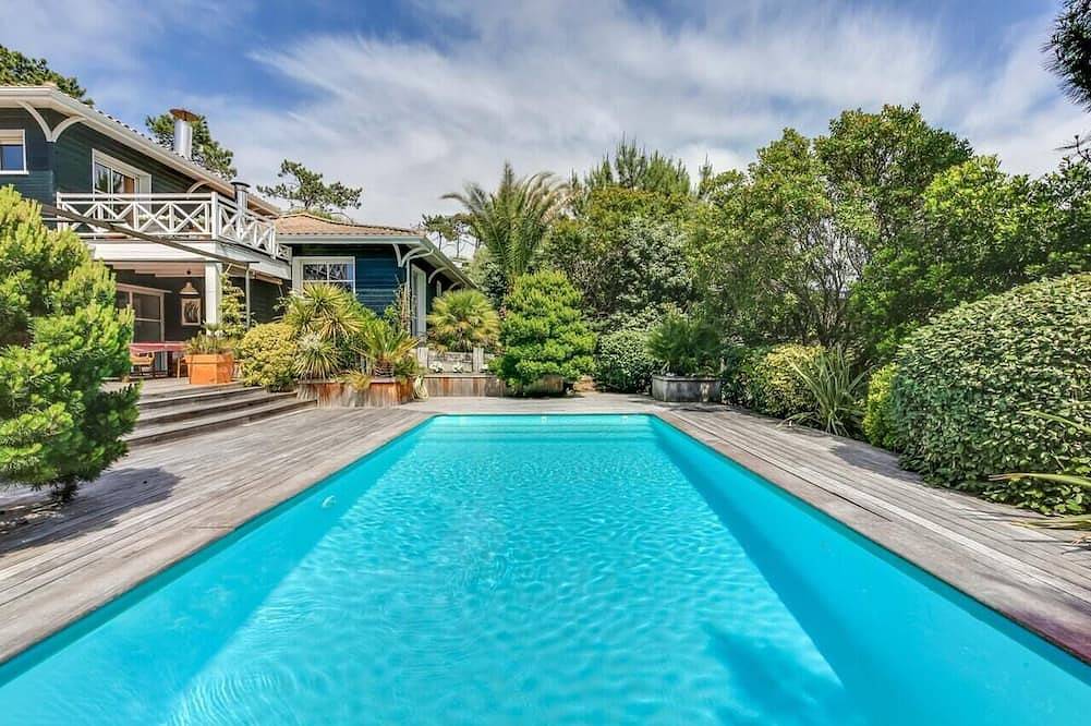 Casa con piscina climatizada entre la piscina y el océano en Cap Ferret in Le Canon, Lège-Cap-Ferret