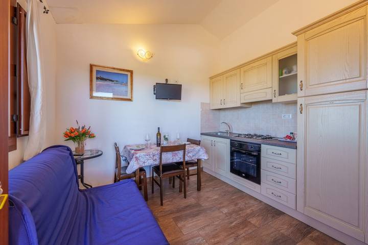Appartamento intero, Appartamento per vacanze "Casa Ginestre" con vista mare, piscina in comune e Wi-Fi in Aglientu, Gallura