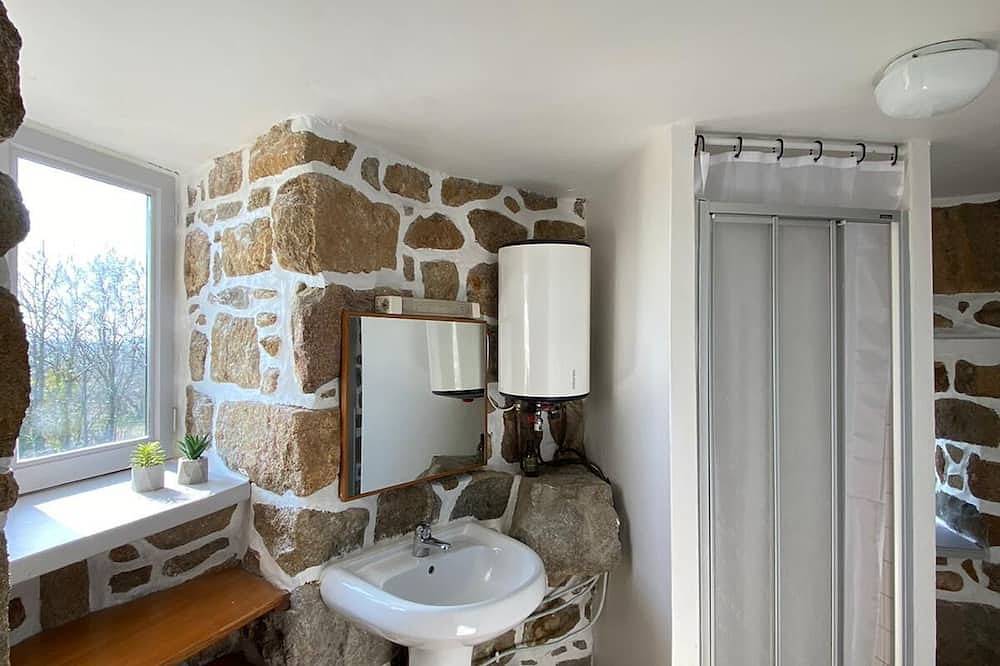 Mill overlooking the sea and the Breton countryside in Lanmodez, Rosa Granitküste