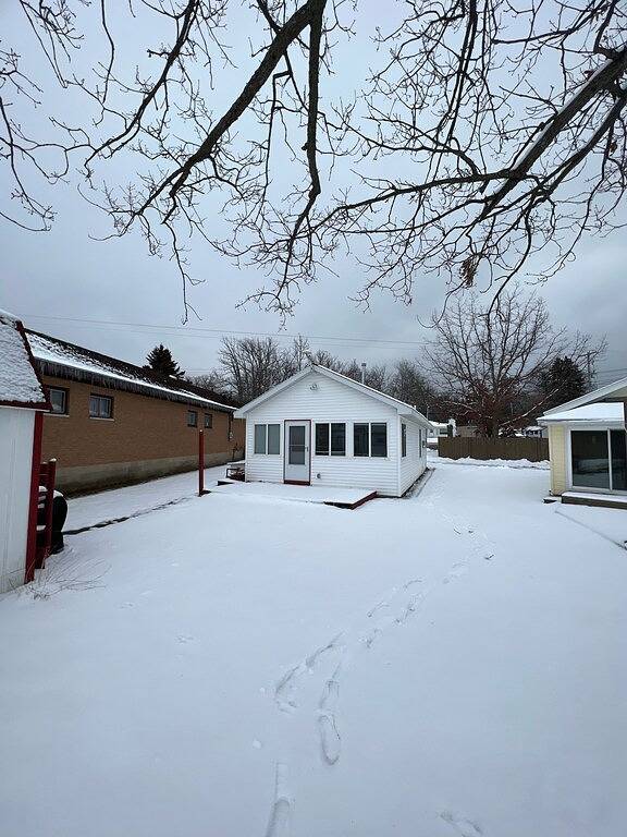 Waterfront house with sandy beach near downtown in Prudenville, Roscommon County