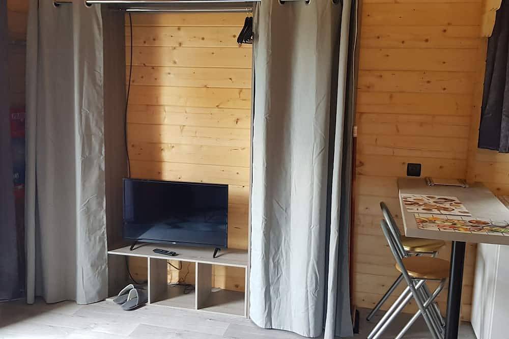 Chaleureux chalet en bois tout équipé in Calorguen, Région de Dinan