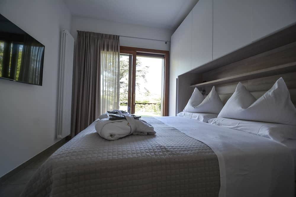 Rustig gelegen 'villetta' met een grote privè tuin in Bardolino, Garda Bergen