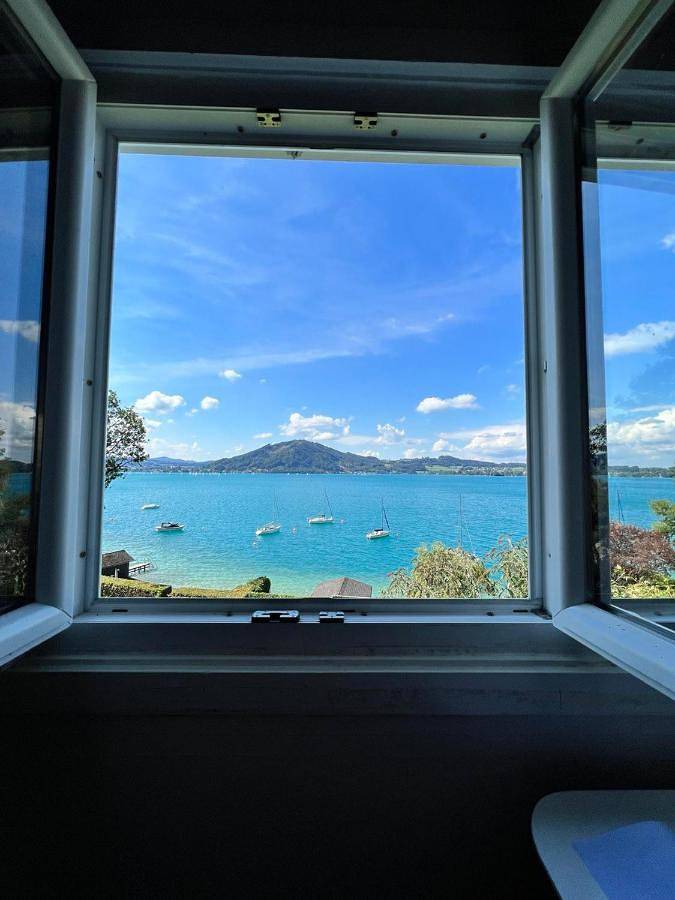 Ferienhaus für 6 Personen, mit Garten und Seeblick sowie Ausblick, mit Haustier am Attersee