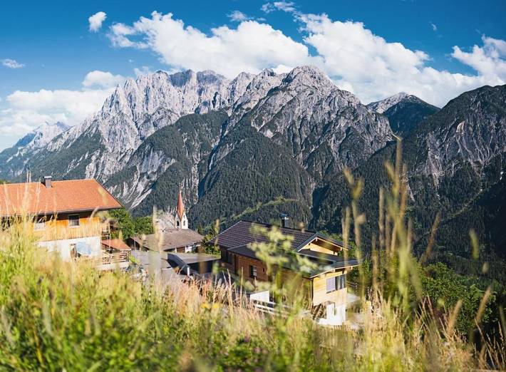 Ferienwohnung für 4 Personen, mit Terrasse und Garten sowie Ausblick in Assling