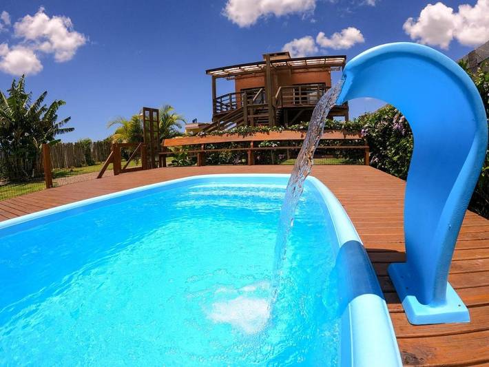 Casas e apartamentos de temporada para 4 pessoas, com vista para o lago e jardim e ainda vista and piscina em Ibiraquera
