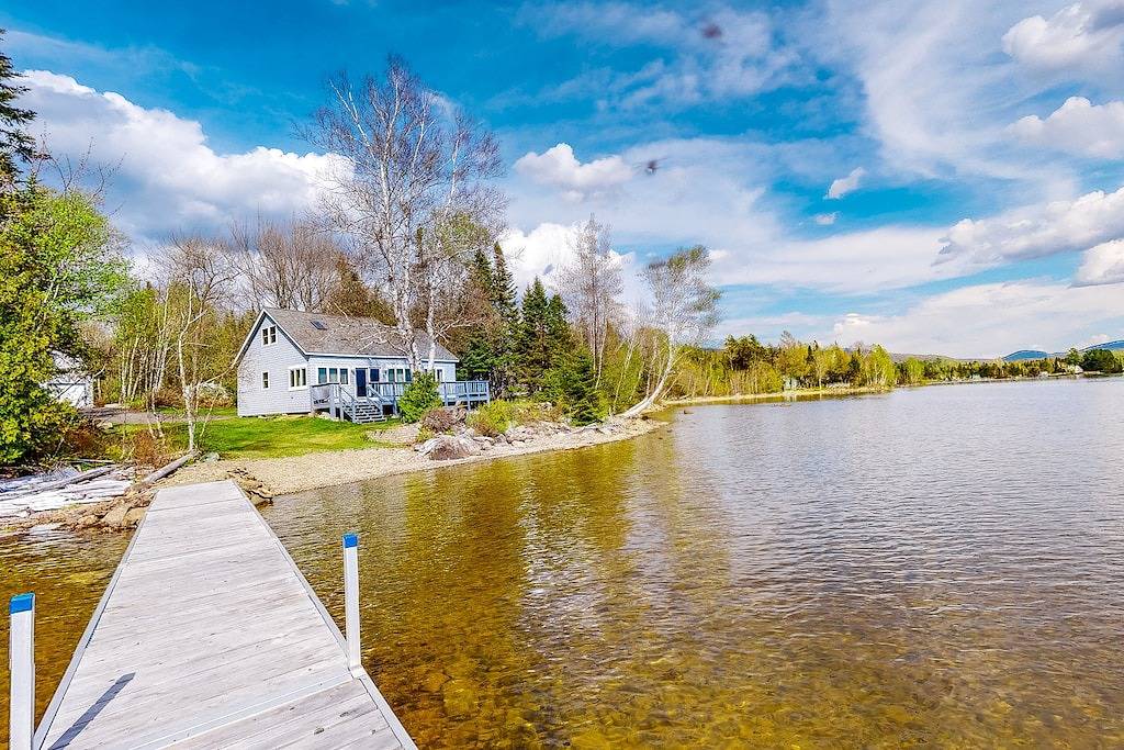 Lakefront home with private dock, mooring, pebble beach, grill, & firepit in Moosehead Lake