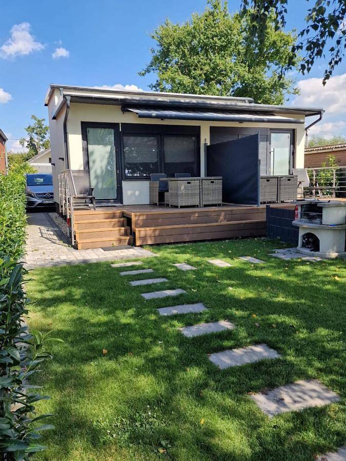 Ferienhaus für 4 Personen, mit Terrasse und Garten sowie Sauna und Seeblick
