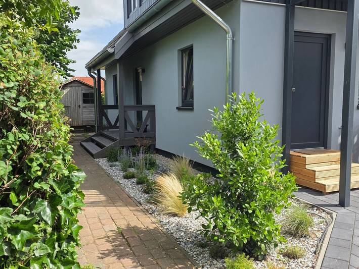 Ferienwohnung für 4 Personen, mit Terrasse und Garten sowie Sauna in Wustrow