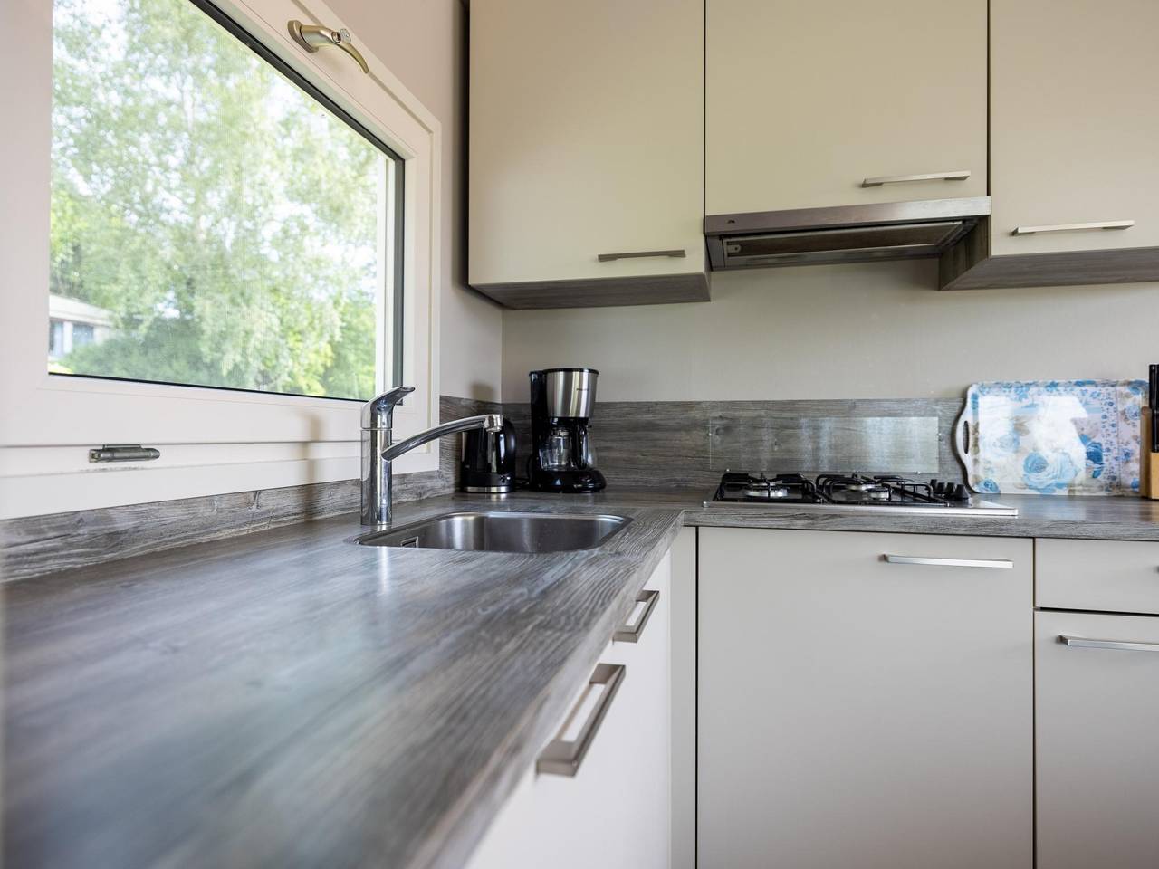 Spacious waterfront chalet including a sloop in Friesland