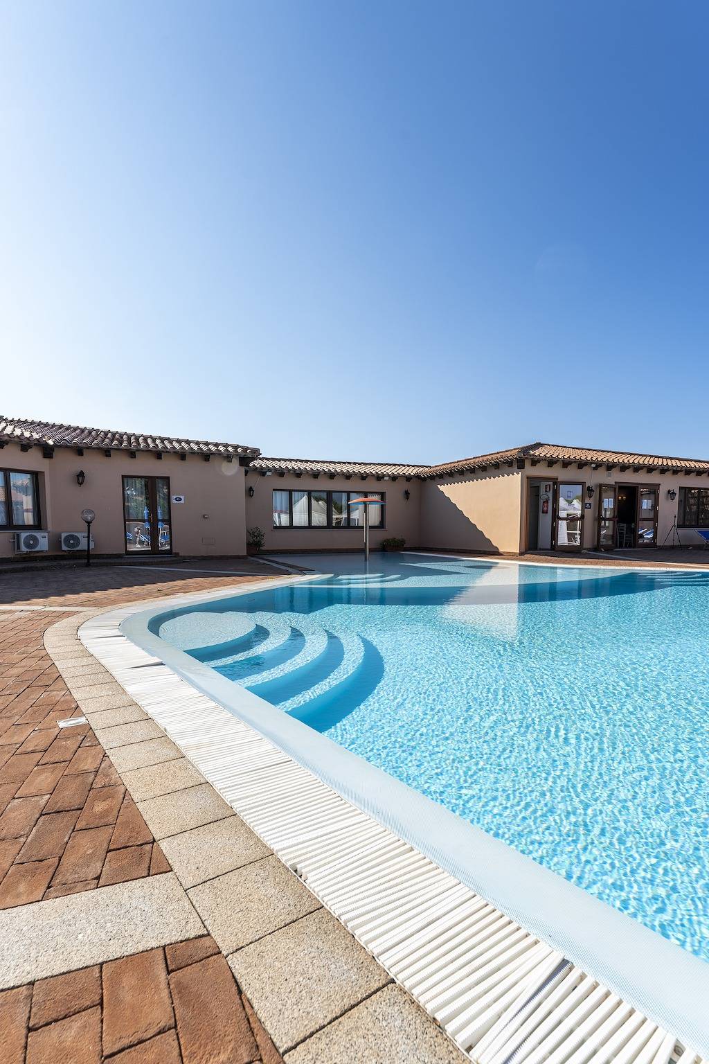 Appartamento intero, Alloggio accogliente con piscina in comune in Lu Lamoni, Vignola Mare