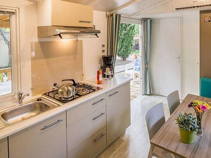 Camping Serenella - Mobile home 4 persons - Mobile-home | Comfort | 2 Bedrooms | 4 Pers. | Raised terrace | Air-con. in Bardolino, Garda Mountains