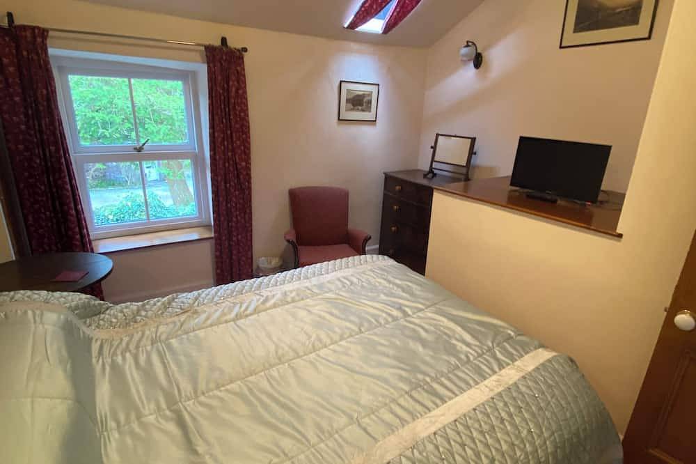 Traditional lakeland cottage refubished without losing old world charm, Car park in Grasmere, Lake District