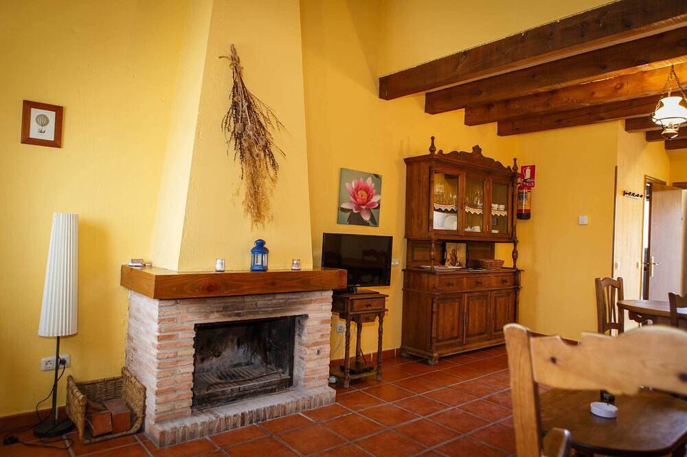 Cottage with wooden ceilings and beams Dormer bedroom and French Fireplace in the Salon in Horcajuelo de la Sierra, Madrid Province