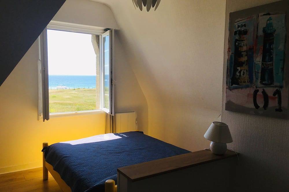 Breton house by the ocean in the dunes of Trez Goarem in Esquibien, Audierne