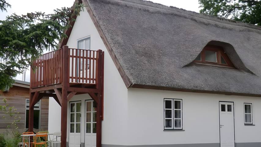 Ferienwohnung für 4 Personen, mit Balkon und Garten sowie Seeblick in Lütow