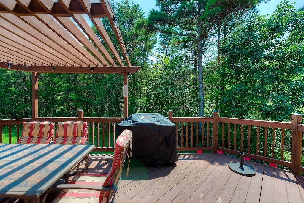 Three-story dog-friendly home with large deck, wood swing, firepit, lawn, & more in Lake Anna