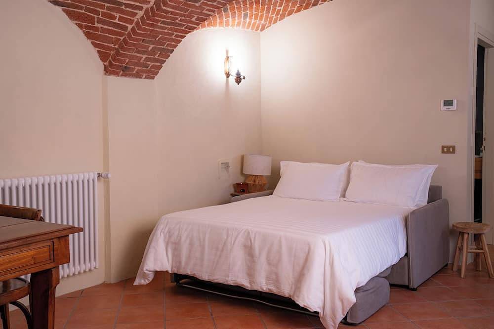 Bruno Selvago's Casba.  Rustic house with exposed brick surrounded by vineyards. in Lessona, Provincie Biella