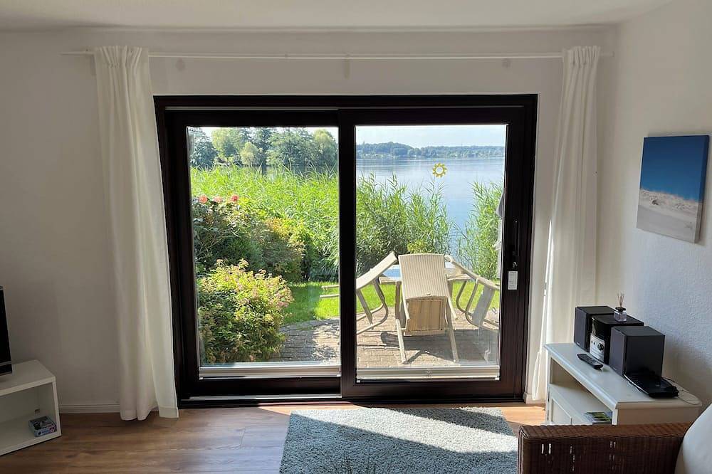 Idyllisches Ferienhaus in Timmdorf auf Seegrundstück mit eigenem Seezugang in Malente, Südliche Ostseeküste